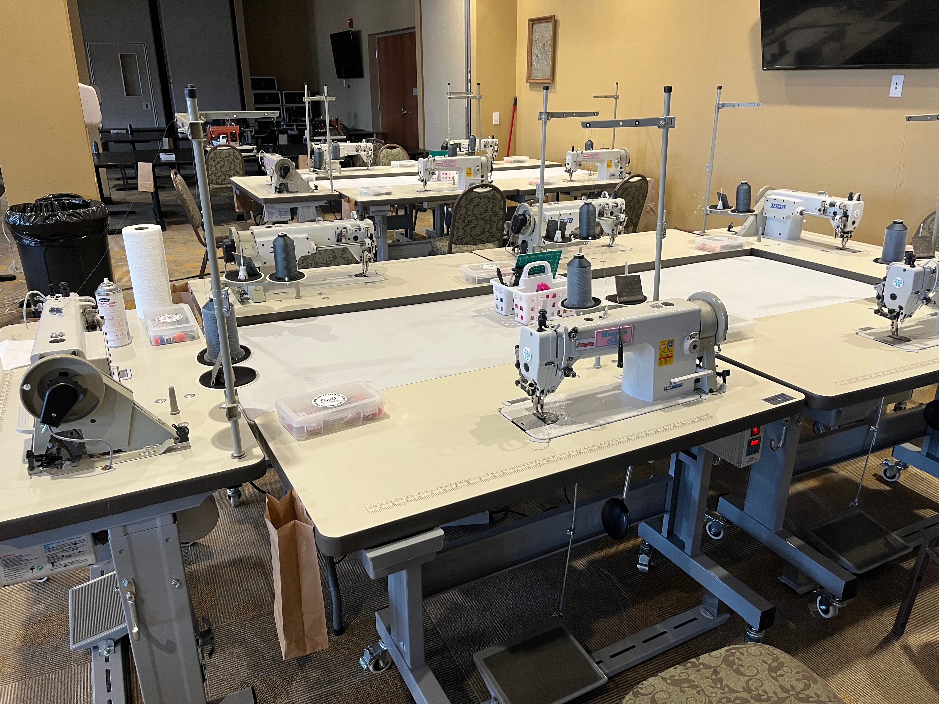 Many Industrial Sewing Machines set up for a sewing retreat