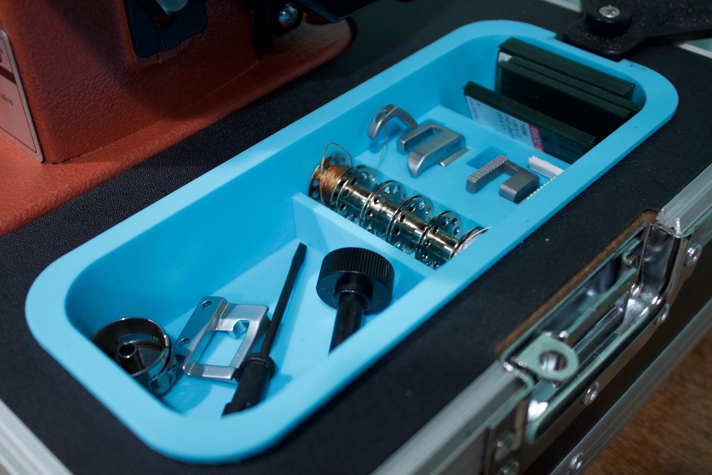 Various tools inside a blue Accessory tray in the Sailrite carrying case