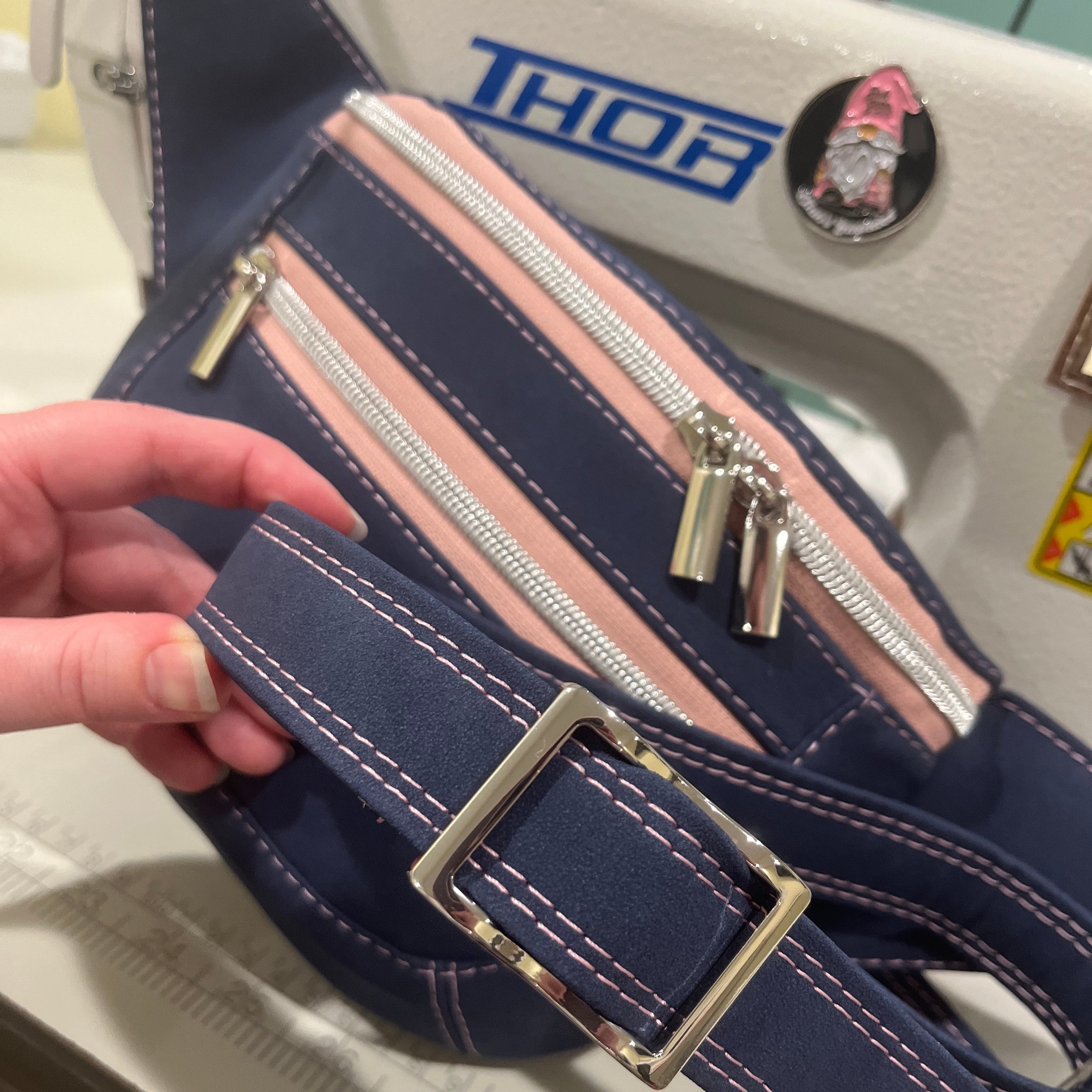 Navy blue fanny pack bag with pink zipper s