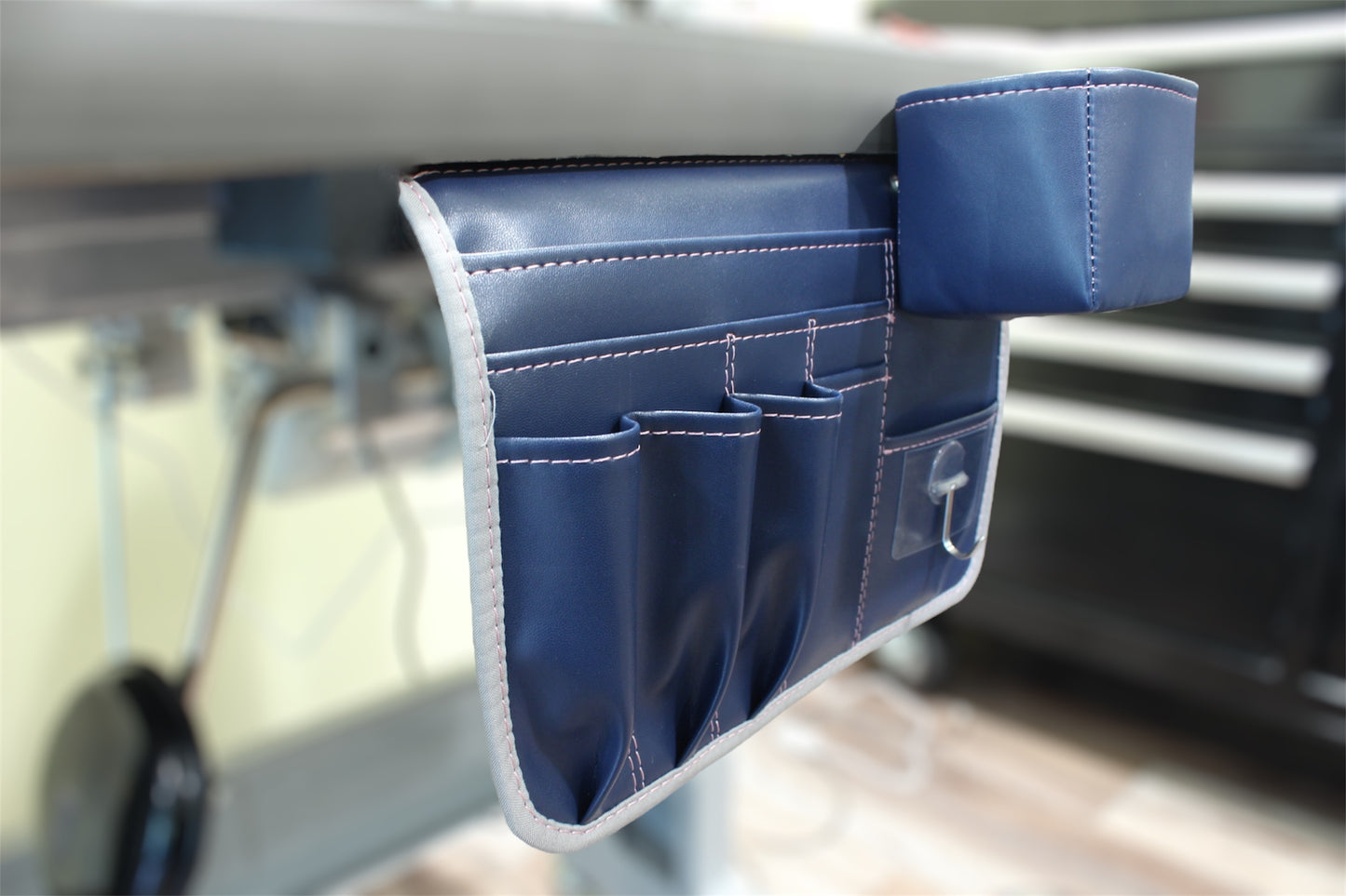 Measure and Cutt Blue organizer hanging from a table