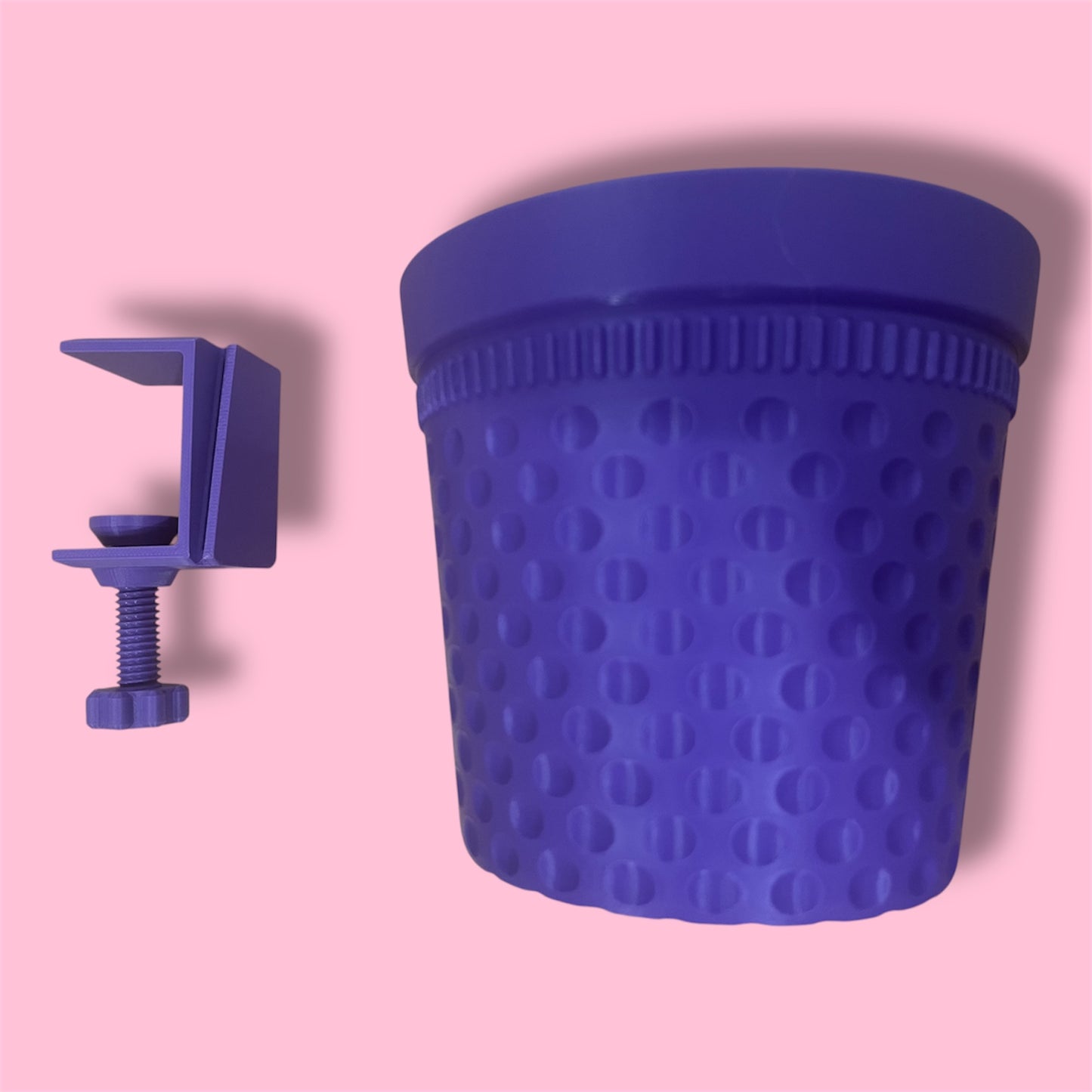 Purple thimble-shaped container bin with the table mount shown separately