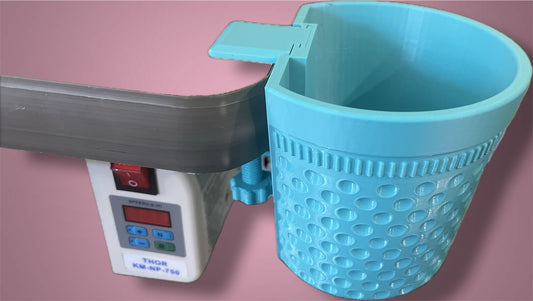 Blue thimble-shaped container bin with threads mounted on table